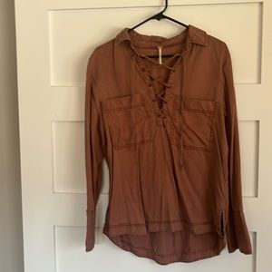 Free people shack it with lace up V-neck size small.